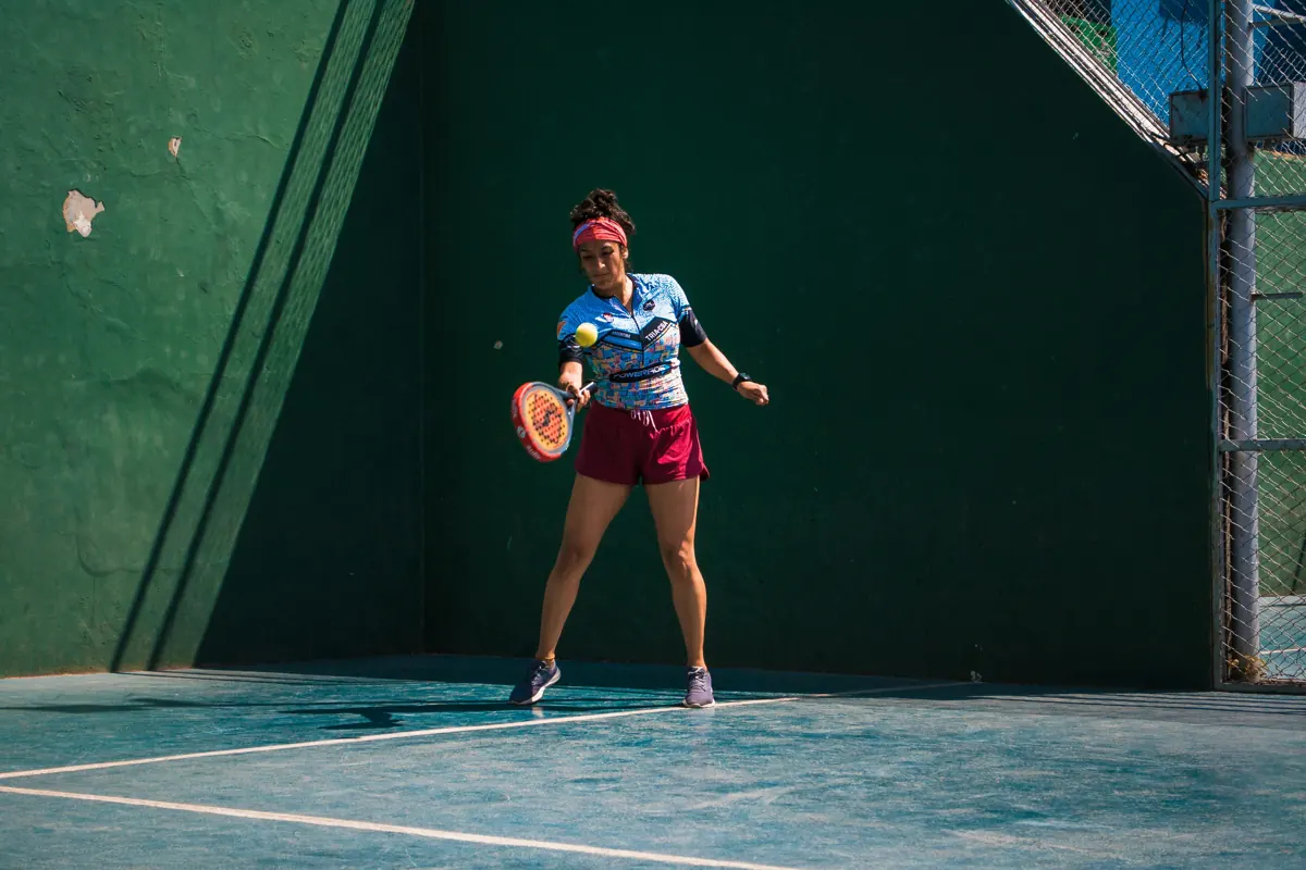 Player hitting off the back wall